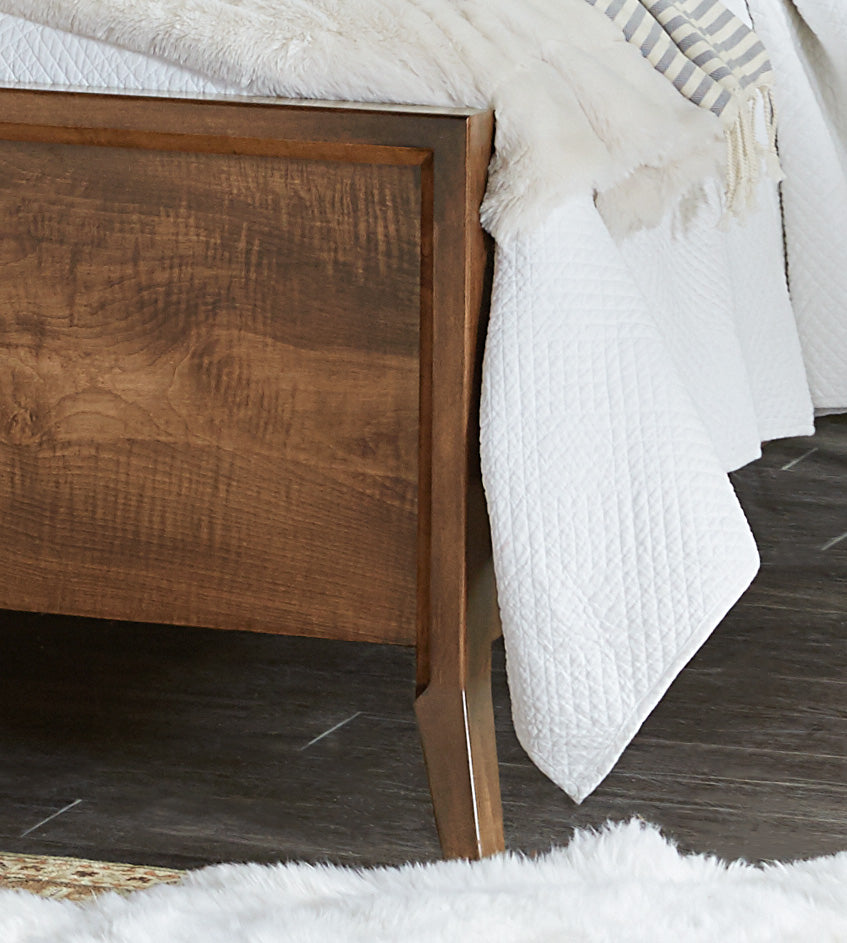 The amish tucson bed shown in brown maple in almond stain