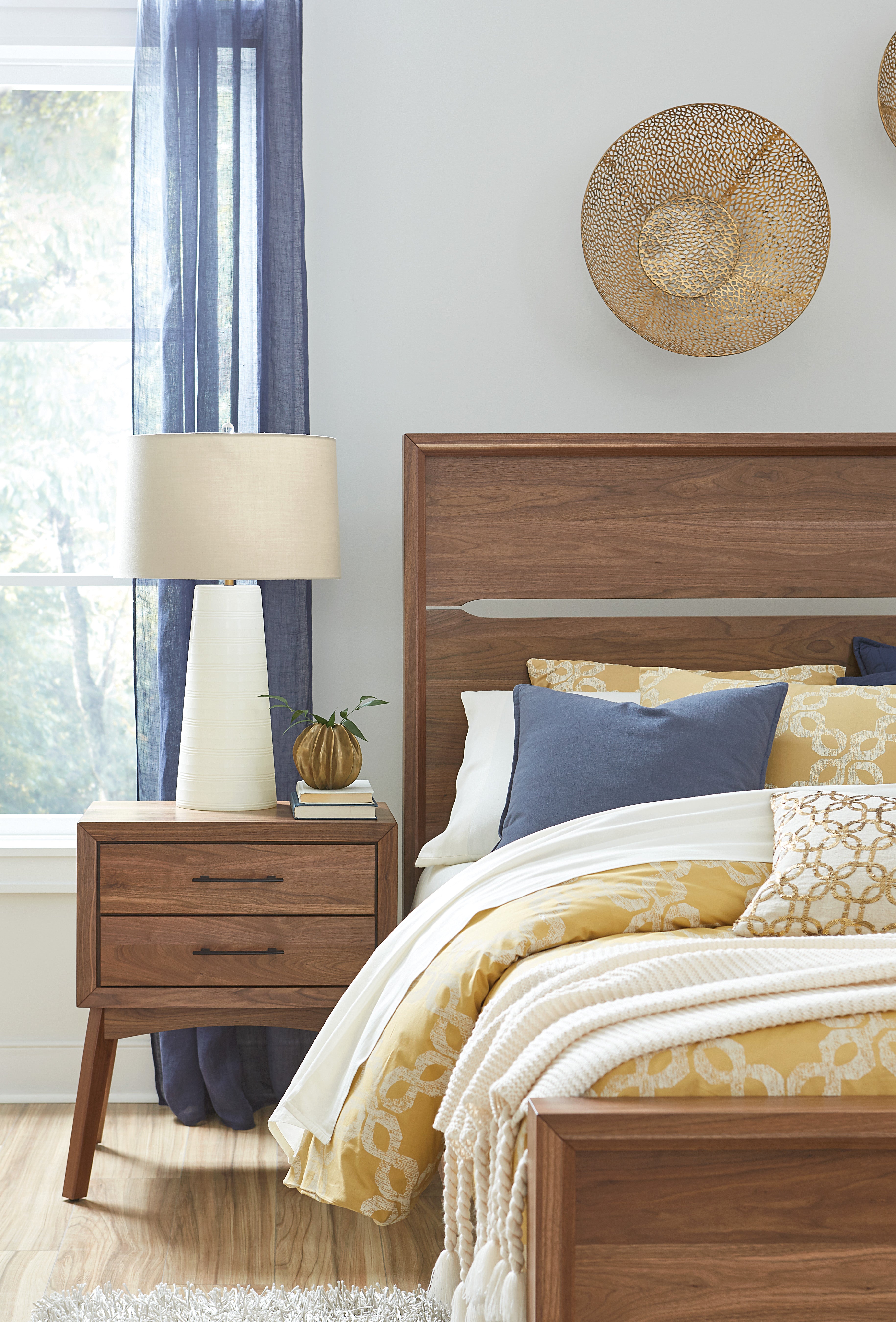 The amish tucson bed shown in brown maple in almond stain