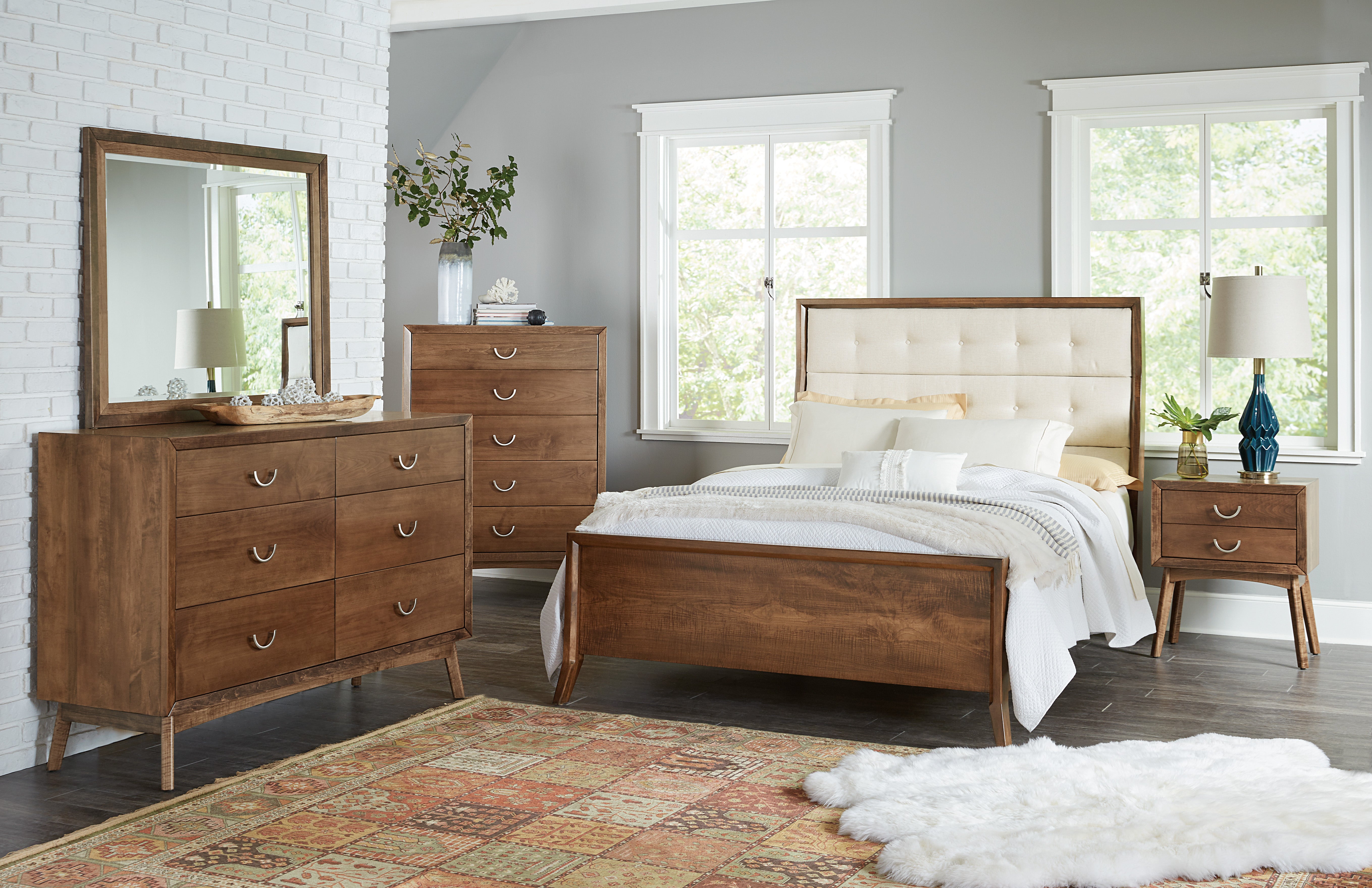 The amish tucson bed shown in brown maple in almond stain with snow white fabric 