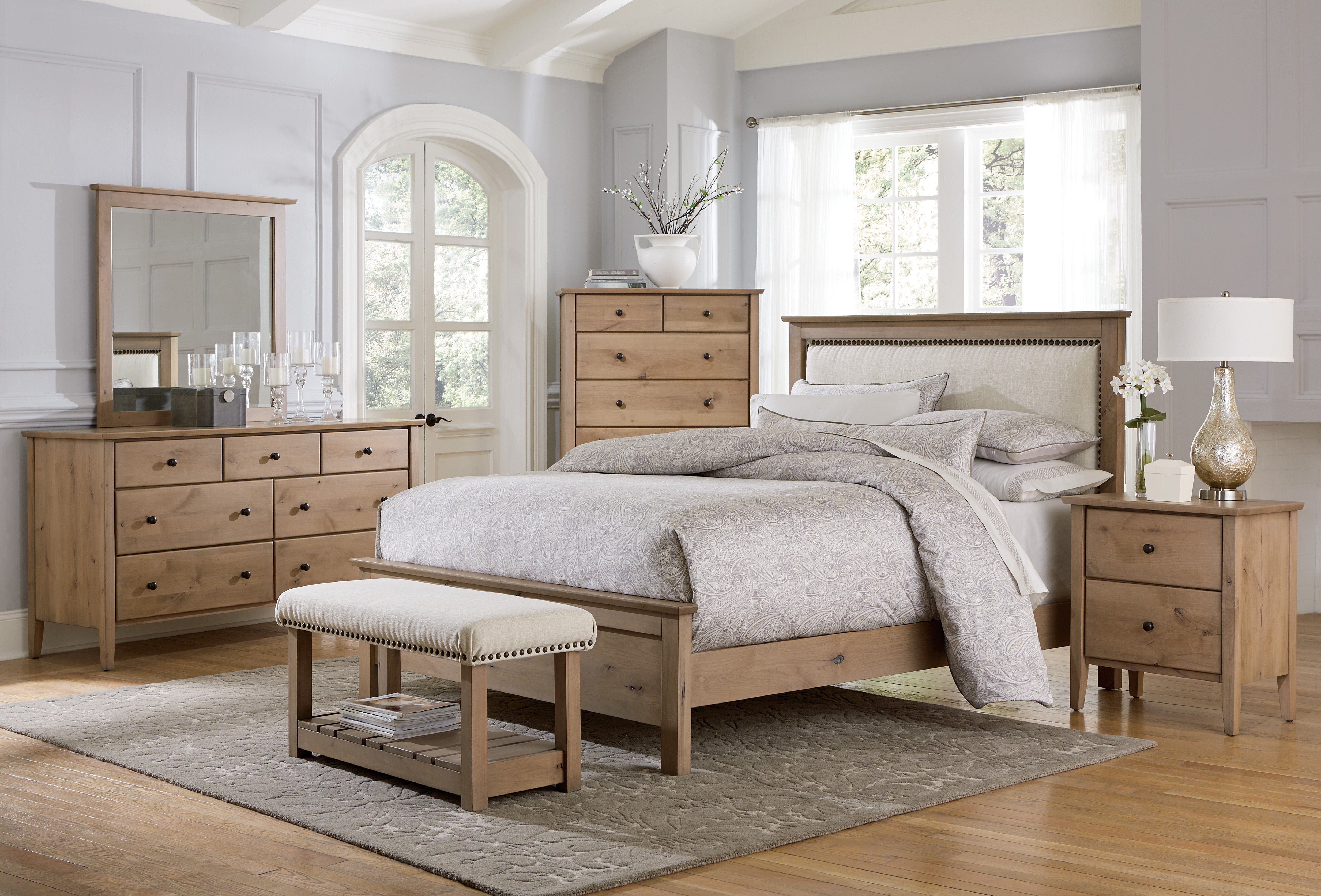 amish medina bed shown in knotty alder with c2-11 canvas fabric with natural nailheads