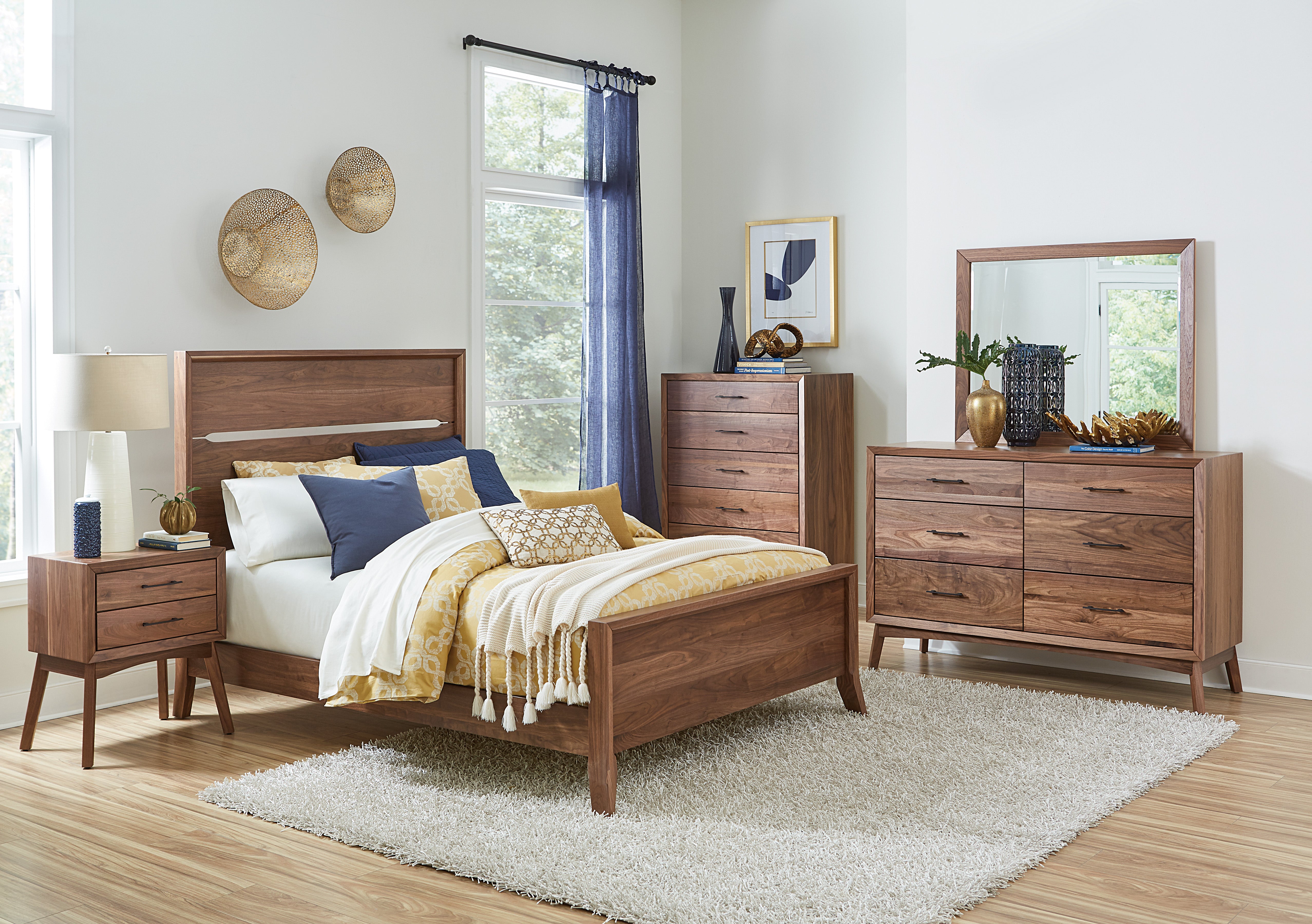 The amish tucson bed shown in brown maple in almond stain