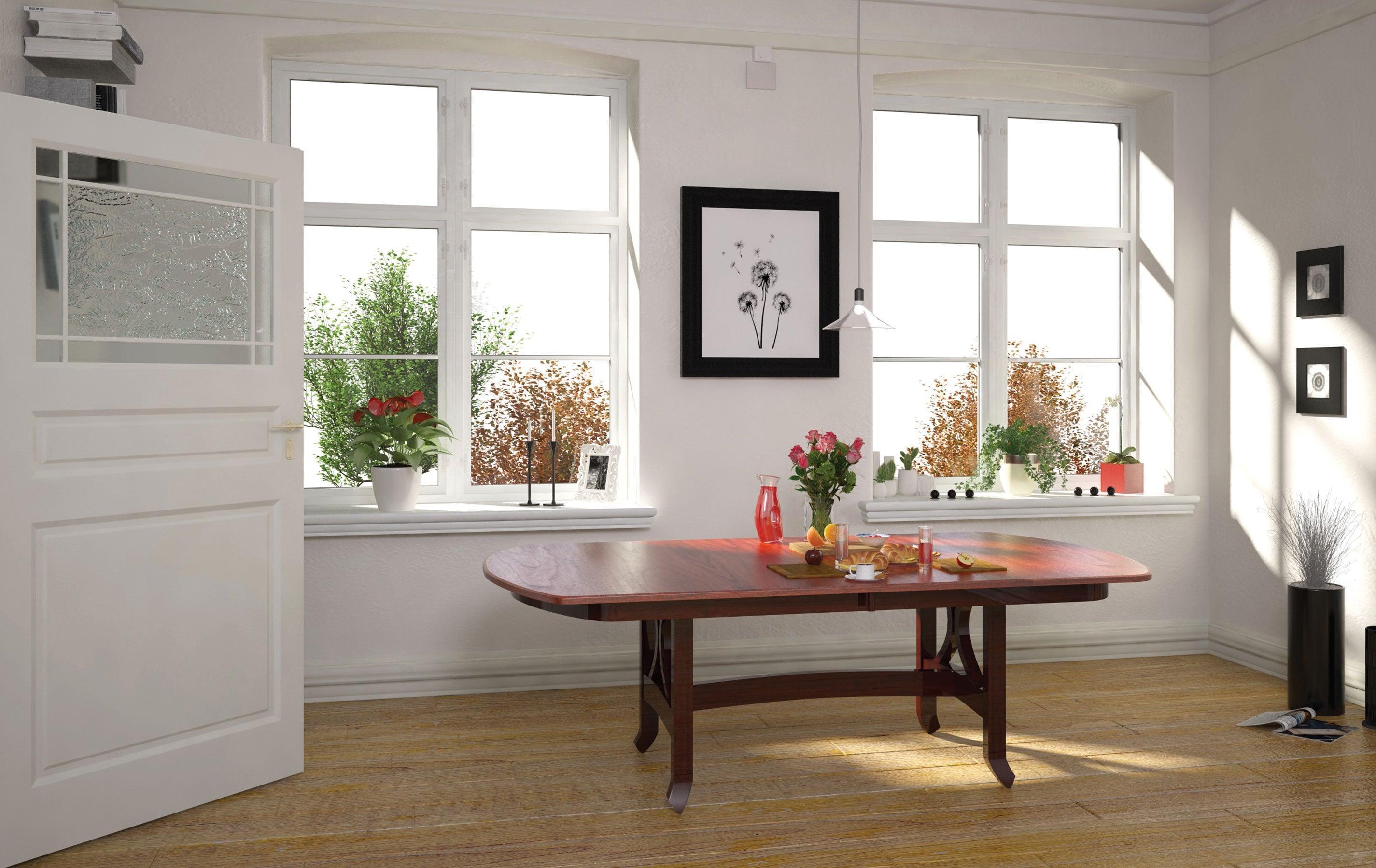 jackson double pedestal table with bowed end in two tone finish in room setting